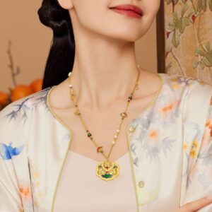 Model wearing a natural Tahitian black pearl pendant necklace with 18k gold plated chain